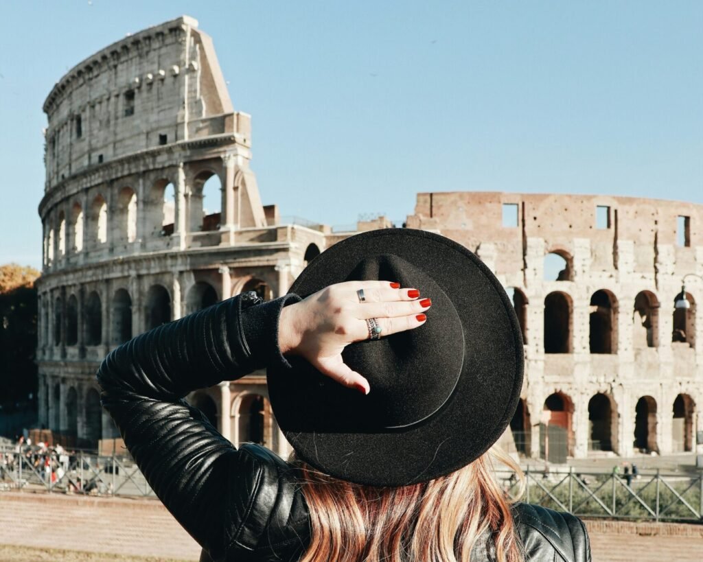 woman looking at Colosseum in Rome